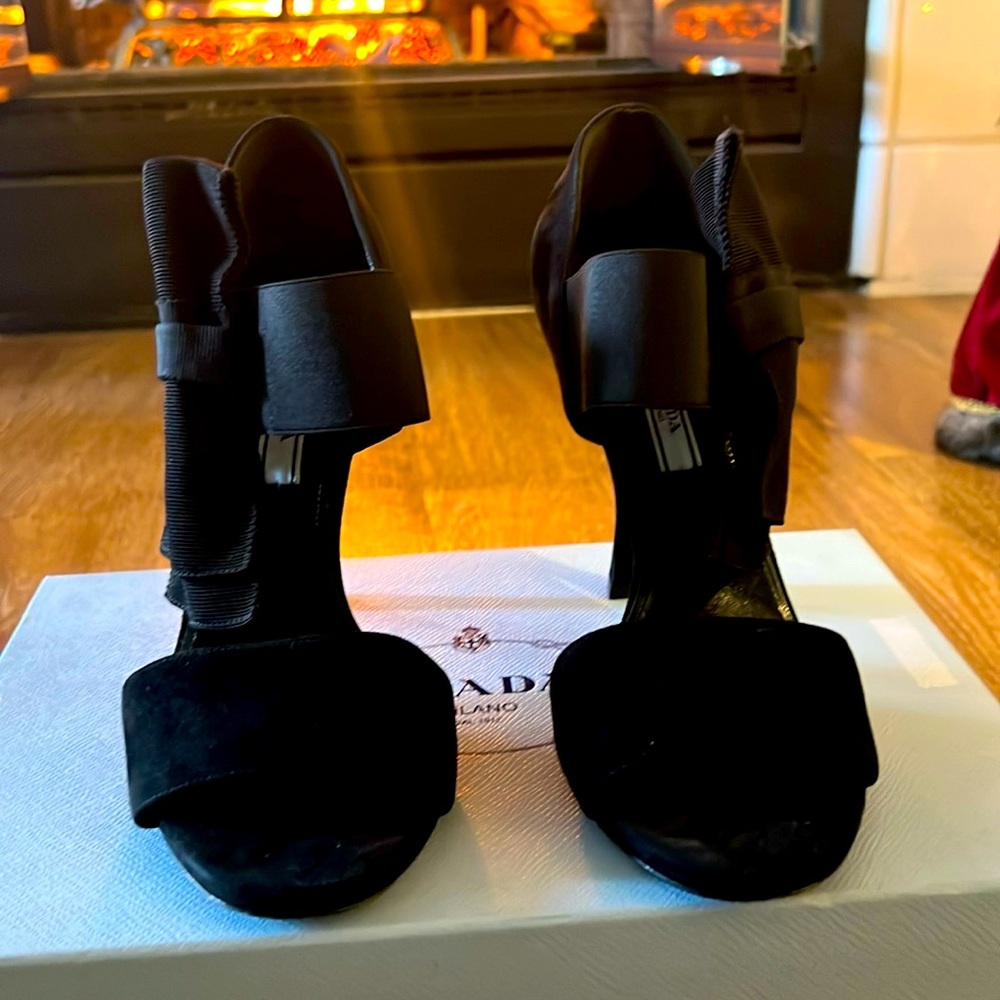 Ladies Prada suede 4 inch heels with fabric bows on each side.